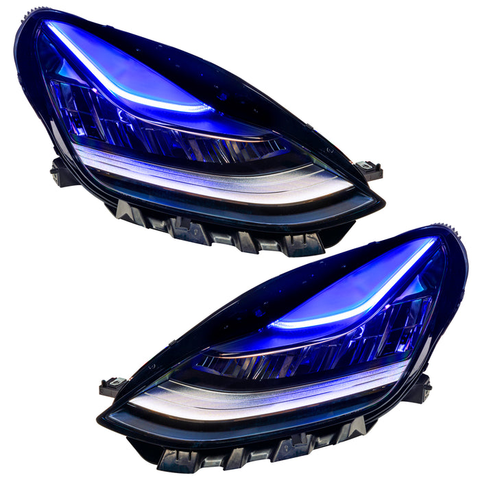 Tesla Model 3 headlights with blue DRLs.