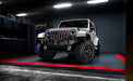 Three quarters view of a white Jeep Wrangler JK with 7" Oculus Headlights installed.