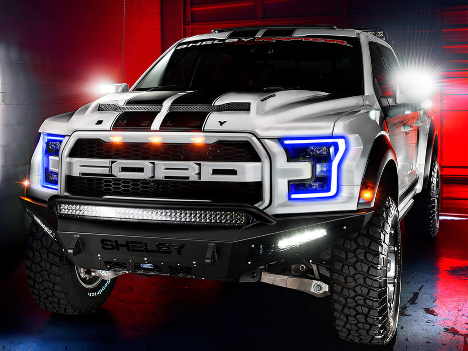 Three quarters view of a Ford Raptor with multiple ORACLE Lighting products installed, including 2015-2020 Ford F-150 LED Off-Road Side Mirrors.