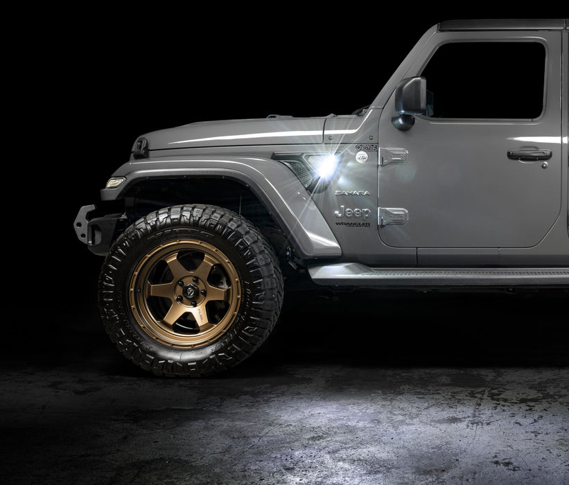 Side view of a Jeep with Sidetrack™ LED Lighting System installed, and set to white LED mode.