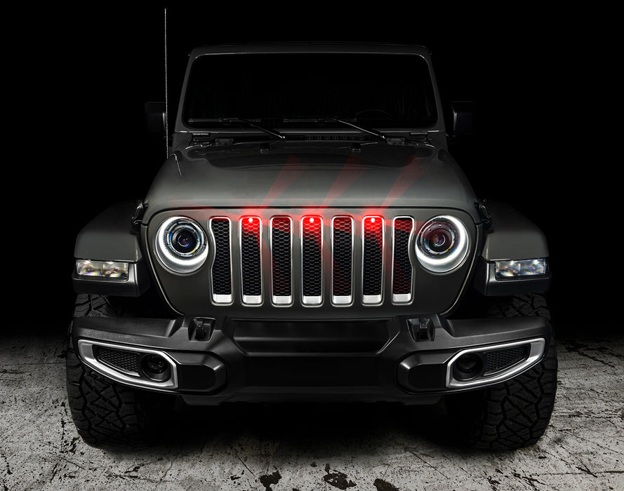 Front end of a Jeep Wrangler JL with red Pre-Runner Style LED Grill Light Kit installed.