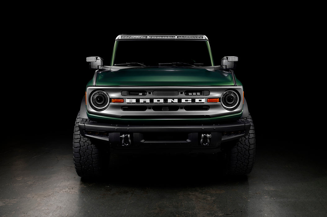 Front view of a green Ford Bronco with LED Off-Road Side Mirrors installed.