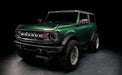 Three quarters view of a green Ford Bronco with LED Off-Road Side Mirrors.