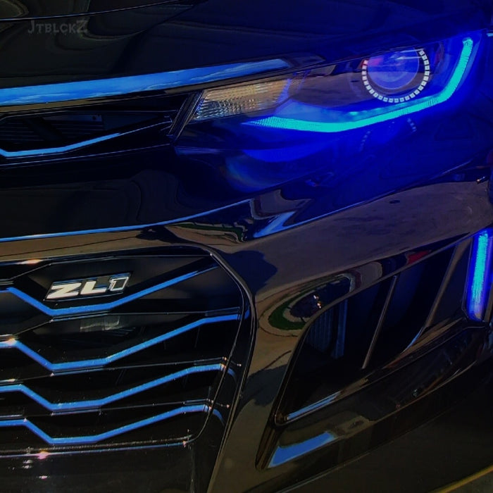 Close-up of a Camaro Headlight with blue DRLs.