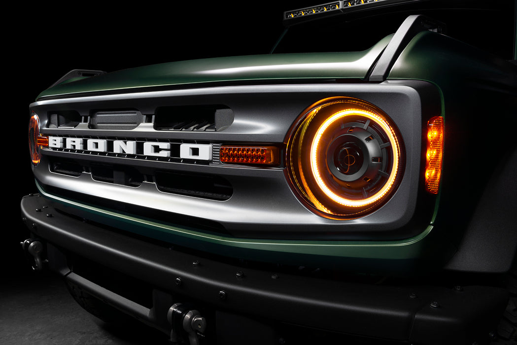 Close-up of a Ford Bronco grill with Oculus Headlights installed, and amber DRLs turned on.