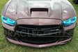 Front end of a Dodge Charger with cyan LED headlight halo rings installed.