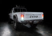 3 quarters rear view of Jeep Comanche with flush mount tail lights and reverse lights on