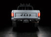 Rear view of Jeep Comanche with flush mount tail lights and brake lights on