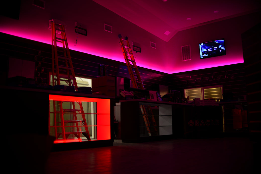 Showroom with pink LED lighting.