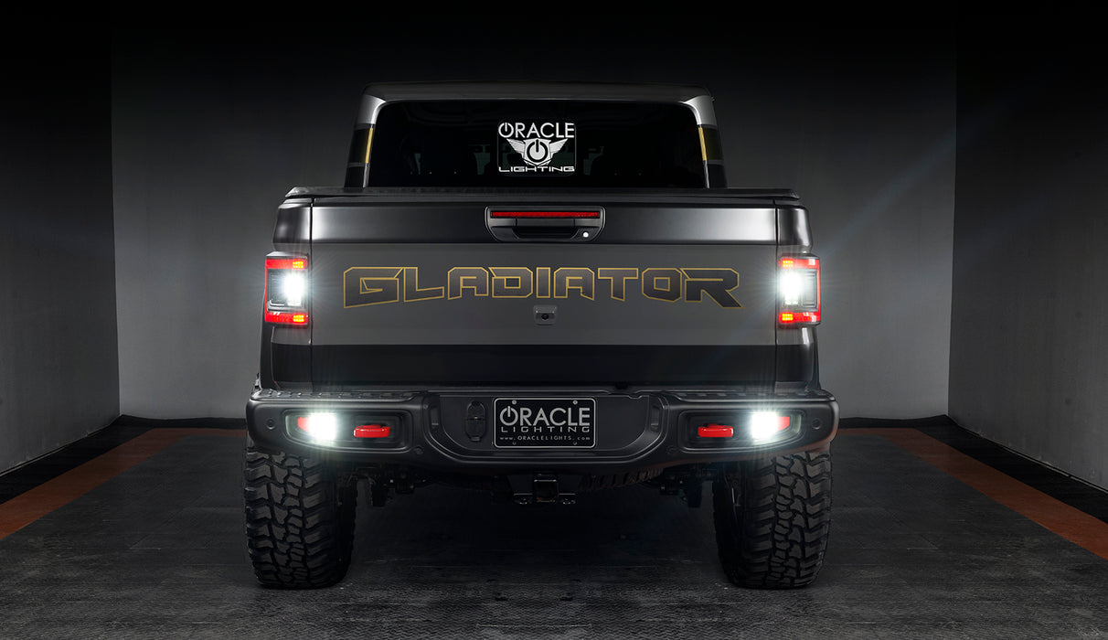 Rear view of a Jeep Gladiator JT with Flush Mount LED Tail Lights installed and reverse lights on.