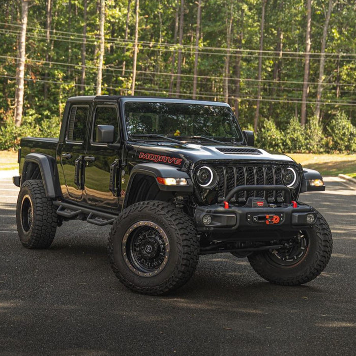 Three quarters view of a black Jeep Gladiator JT equipped with Oculus Headlights.