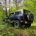 Rear view of Ford Bronco in a forest with Flush Style LED Tail Lights installed.