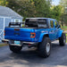 Rear three quarters view of a blue Jeep Gladiator with Flush Mount LED Tail Lights installed.