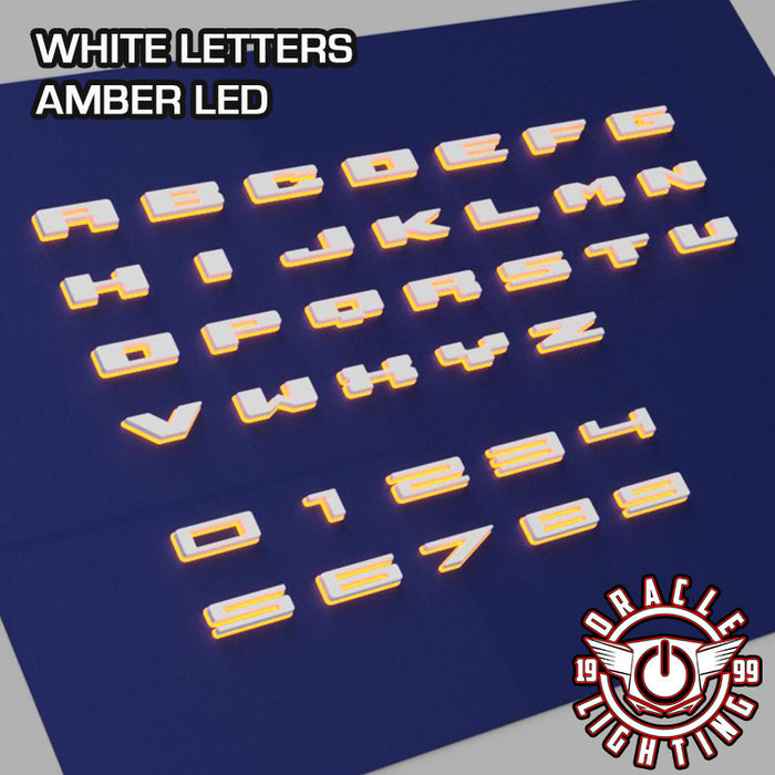 Amber LED Illuminated Letter Badges with Matte White finish.