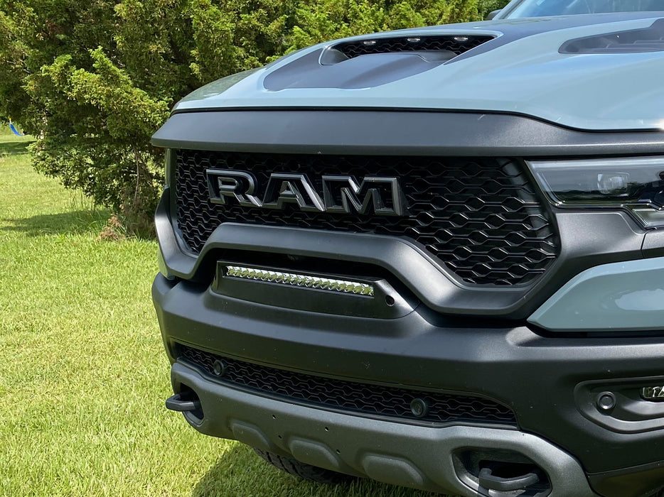 Extreme close-up of of a Front Bumper Flush LED Light Bar System with white LEDs installed on a RAM TRX.