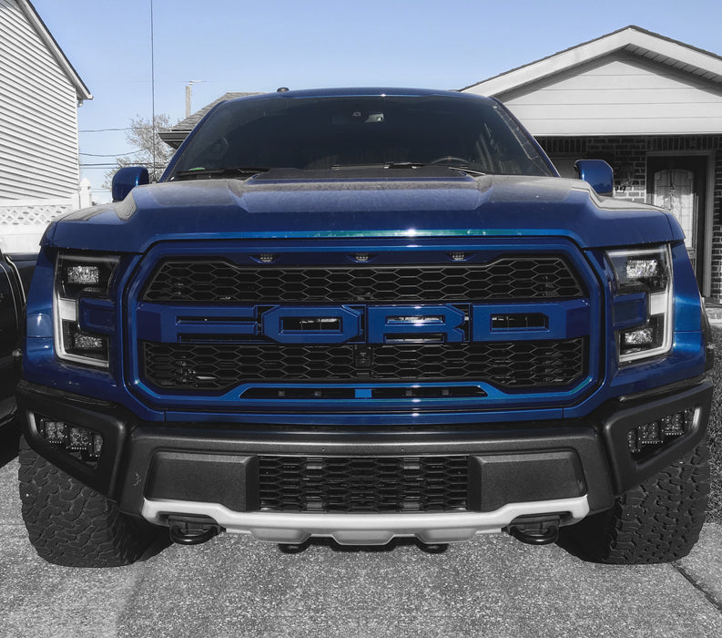 Ford Raptor with Black Series - 7D 3" 20W LED Square Spot/Flood Lights installed in the fog light housings.