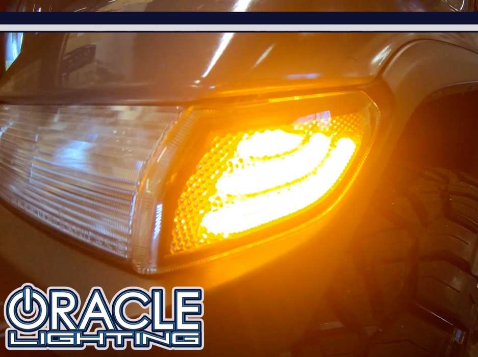 Close-up of "Smoked Lens" LED Front Sidemarkers installed on a Jeep and glowing amber.