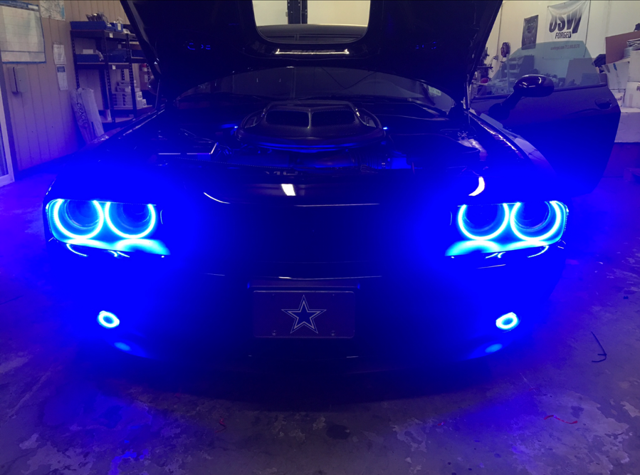 Dodge Challenger in garage with blue surface mount halos installed.