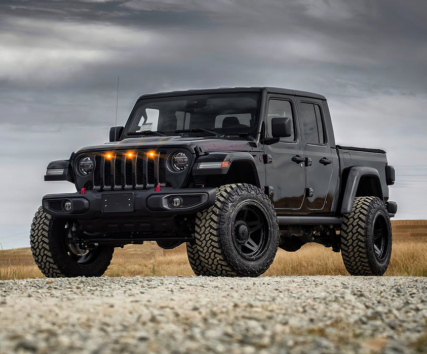 Lifestyle image of a Jeep Gladiator with amber Pre-Runner Style LED Grill Light Kit installed.
