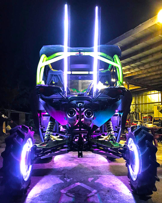 Rear end of an off-road vehicle with two Off-Road 4ft ColorSHIFT LED Whips installed.