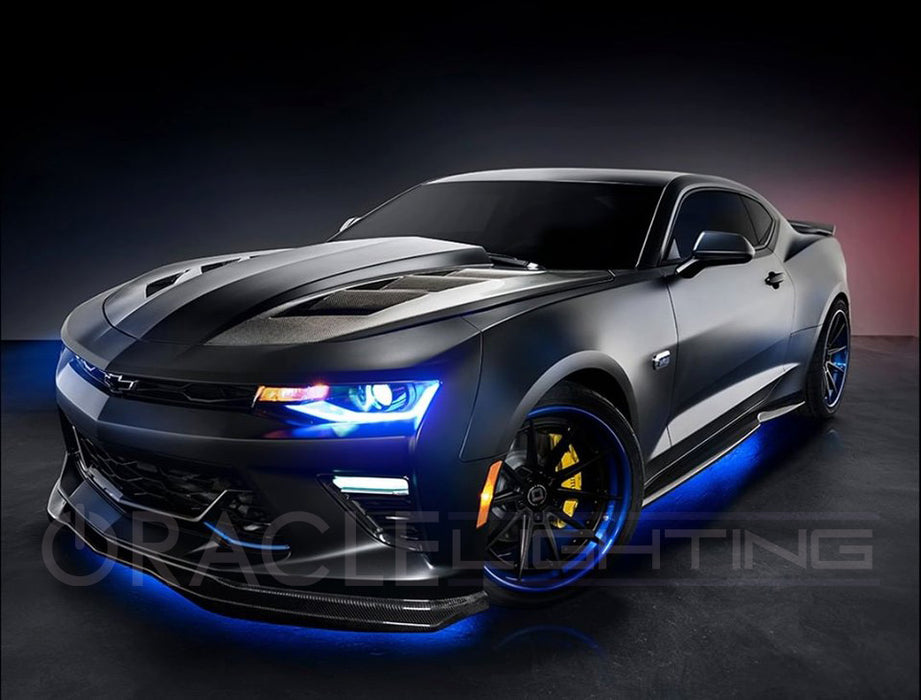 Three quarters view of a Chevrolet Camaro with blue headlight and fog light DRLs.