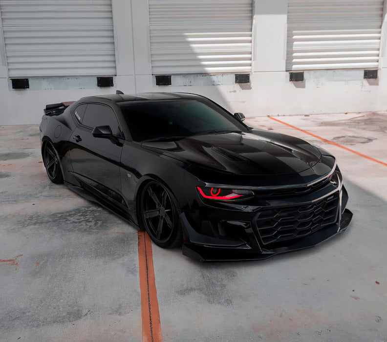 Black camaro in parking lot with red DRL