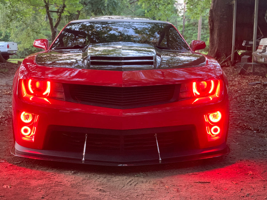 Front end of a Chevrolet Camaro with red LED headlight and fog light halo rings installed.