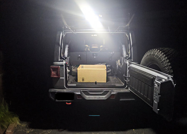 Rear view of a Jeep Wrangler with Cargo LED Light Module installed and turned on.