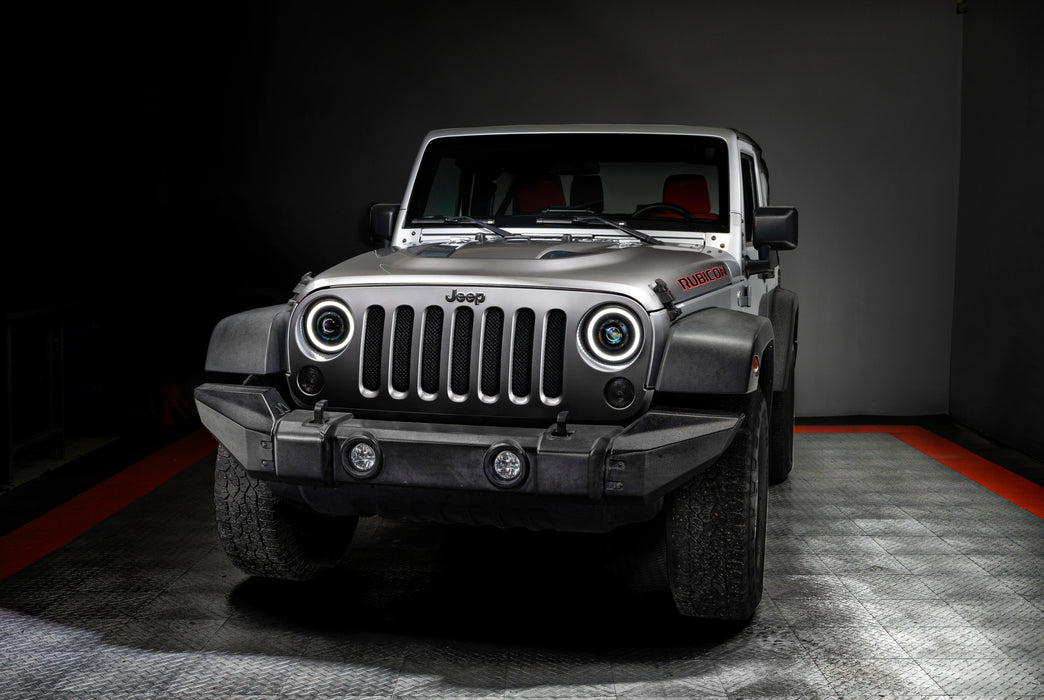 Front view of a Jeep Wrangler JK with 7" Oculus Headlights installed, with white halos on.