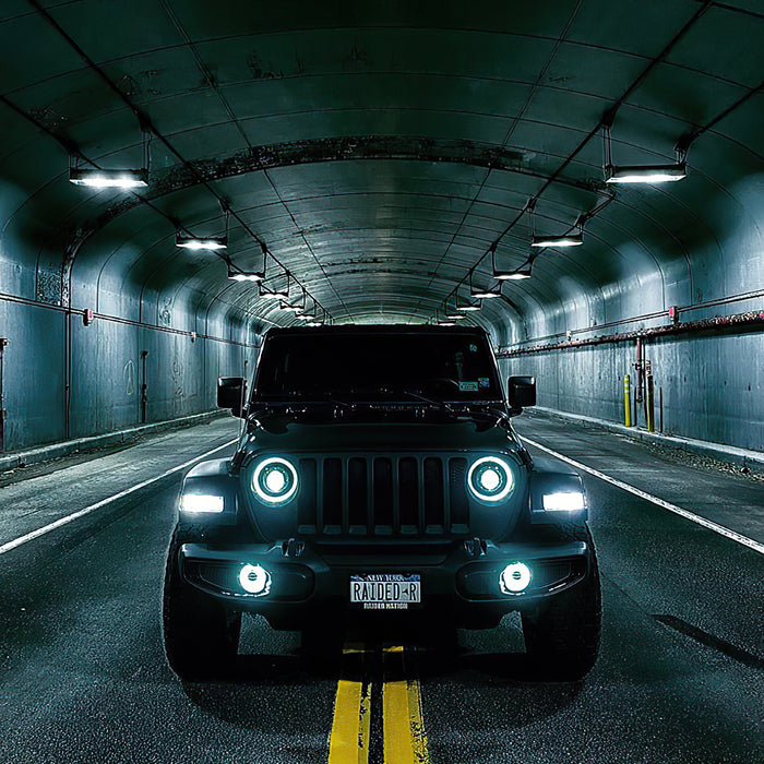 Front view of a Jeep with multiple ORACLE Lighting products installed, including Oculus Headlights.