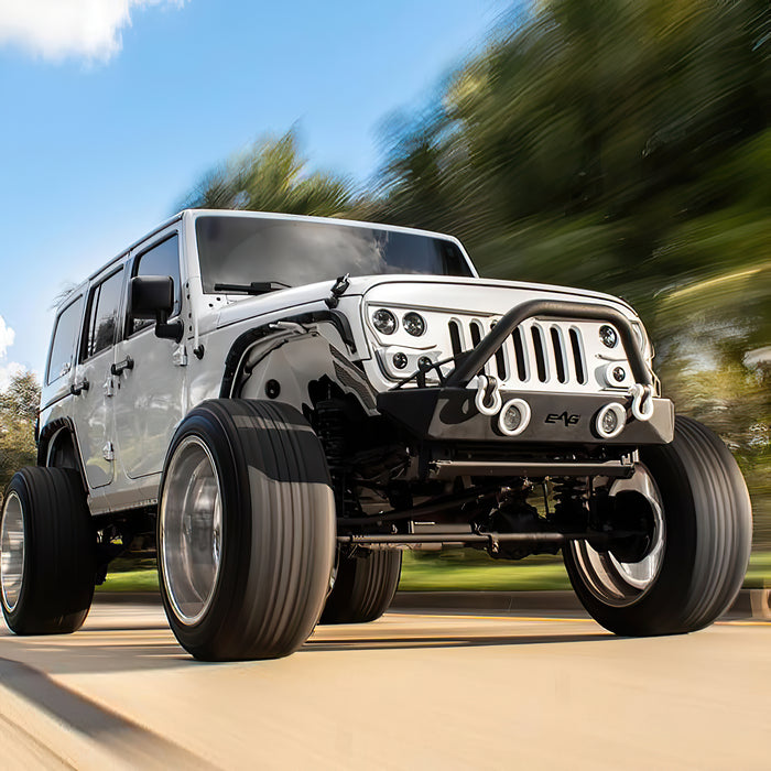Three quarters view of a white Jeep Wrangler JK with Vector Pro-Series Grill installed.
