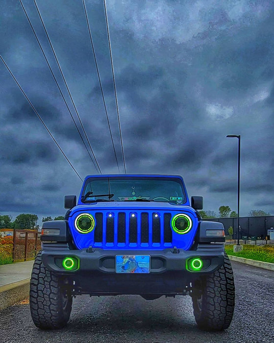 Front view of a Jeep with ColorSHIFT Oculus Headlights installed, and green halos on.