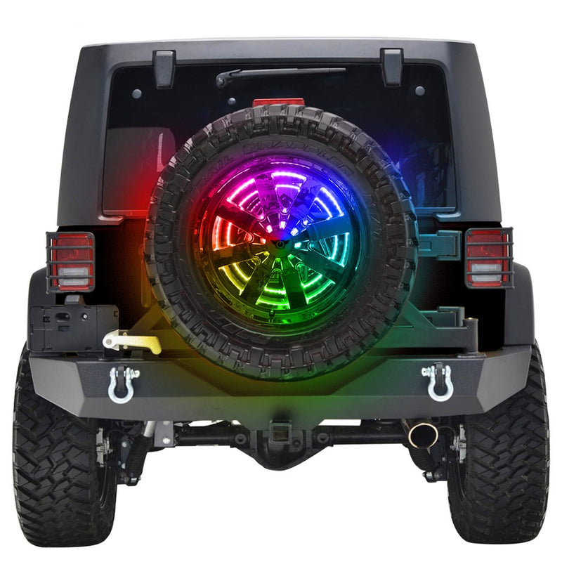 A spare tire with rainbow lights on the back of a Jeep