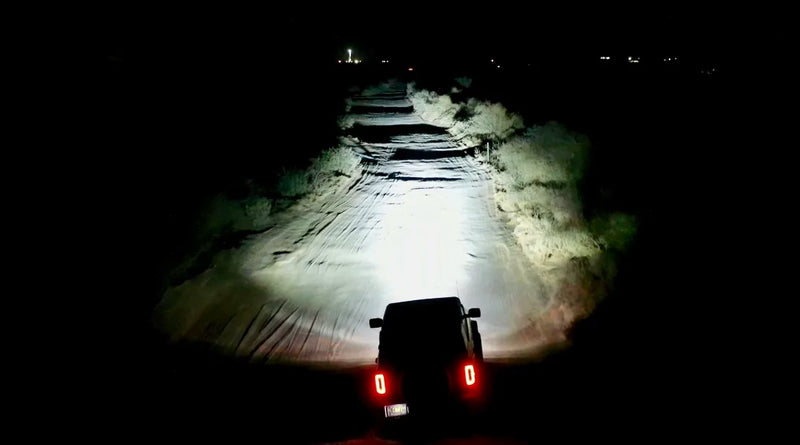 Customer Review: Baja Designs LP6 -VS- ORACLE Lighting Vega 7 Spotlights, showcasing bright lights illuminating a night trail.