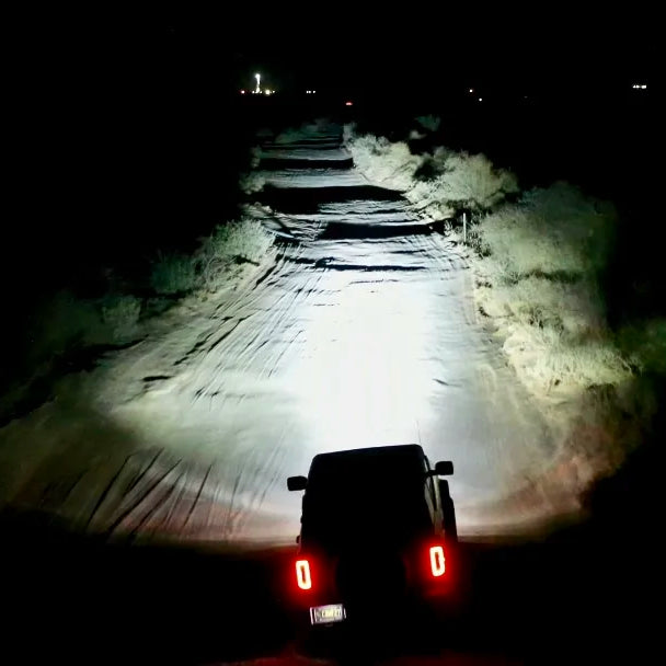 Customer Review: Baja Designs LP6 -VS- ORACLE Lighting Vega 7 Spotlights, showcasing bright lights illuminating a night trail.