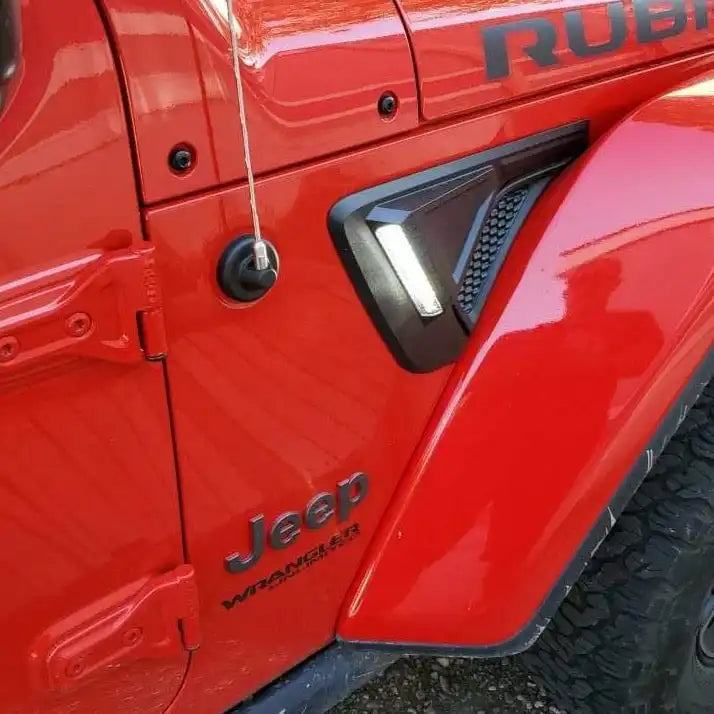 Close-up of Sidetrack™ LED Lighting System installed on a Jeep, with white LEDs on.