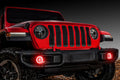 Red Jeep Gladiator with red fog light halos installed.