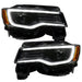 Jeep Grand Cherokee headlights with white DRLs.