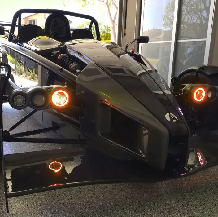 Ariel Atom with amber headlight halos.