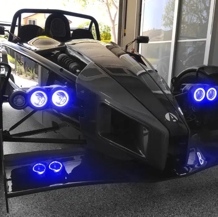 Ariel Atom with blue headlight halos.