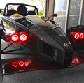 Ariel Atom with red headlight halos.