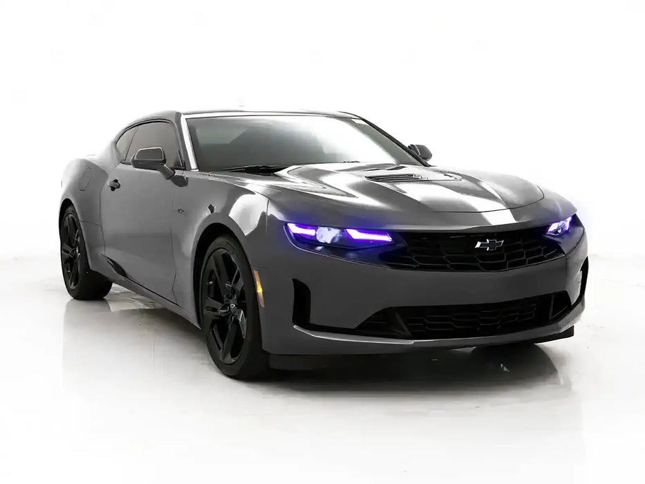 Three quarters view of a Chevrolet Camaro with purple headlight DRLs.