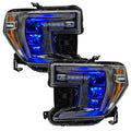 GMC Sierra 1500 headlights with blue demon eye projectors.
