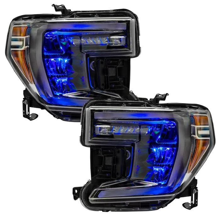 GMC Sierra 1500 headlights with blue demon eye projectors.
