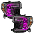 GMC Sierra 1500 headlights with pink demon eye projectors.