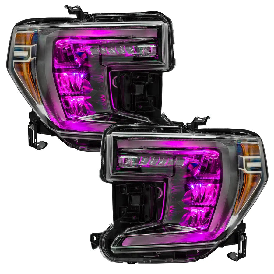 GMC Sierra 1500 headlights with pink demon eye projectors.
