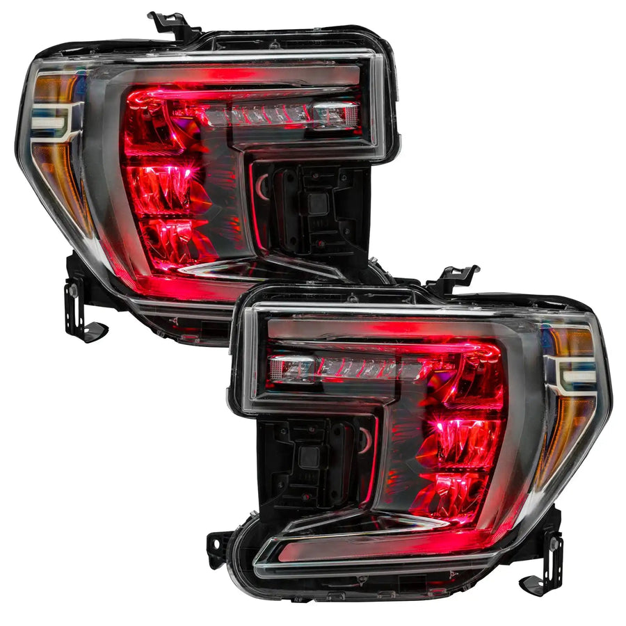 GMC Sierra 1500 headlights with red demon eye projectors.