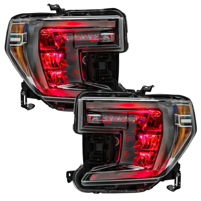 GMC Sierra 1500 headlights with red demon eye projectors.