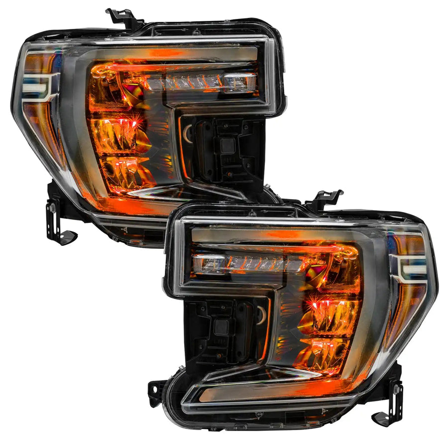 GMC Sierra 1500 headlights with amber demon eye projectors.