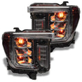 GMC Sierra headlights with amber demon eye projectors.
